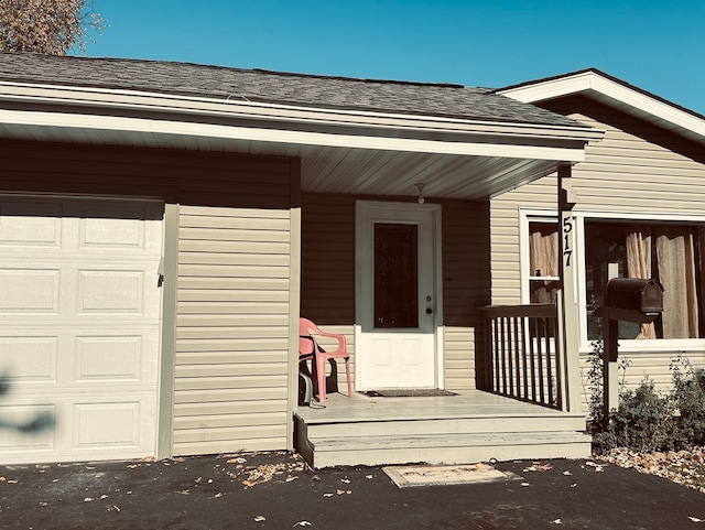 entrance to property featuring a garage