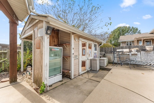 view of outbuilding featuring an outdoor kitchen