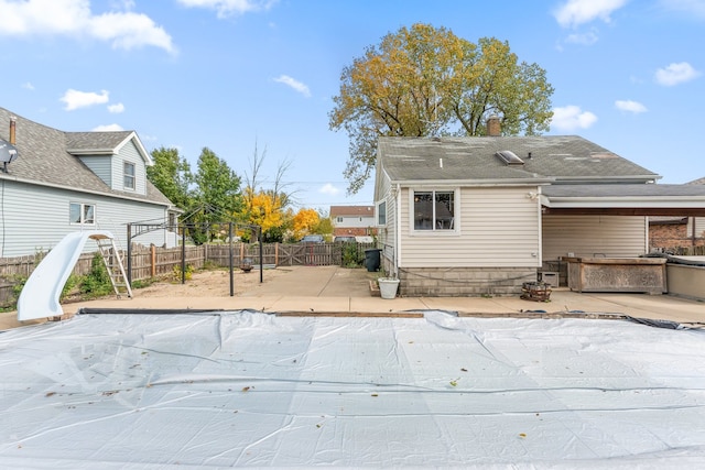 back of house with a patio