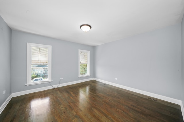 unfurnished room featuring dark hardwood / wood-style floors