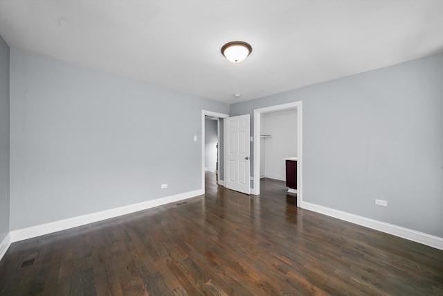 spare room with dark hardwood / wood-style flooring