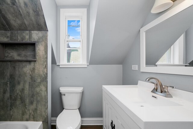 full bathroom with vanity, toilet, lofted ceiling, and plus walk in shower