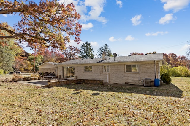 back of property with a patio area, a lawn, and central AC unit