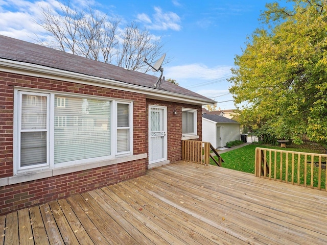 wooden terrace with a yard