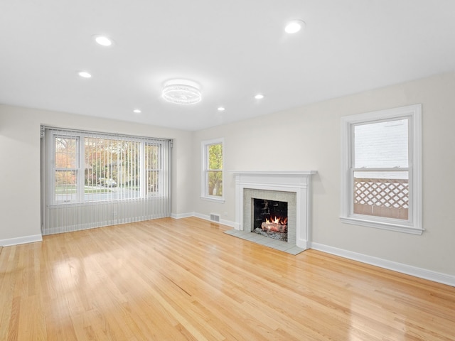 unfurnished living room featuring light wood-type flooring