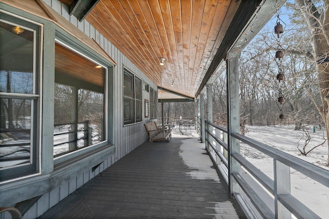 view of snow covered deck