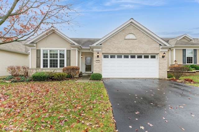 ranch-style home featuring a garage