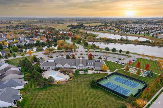 aerial view at dusk with a water view