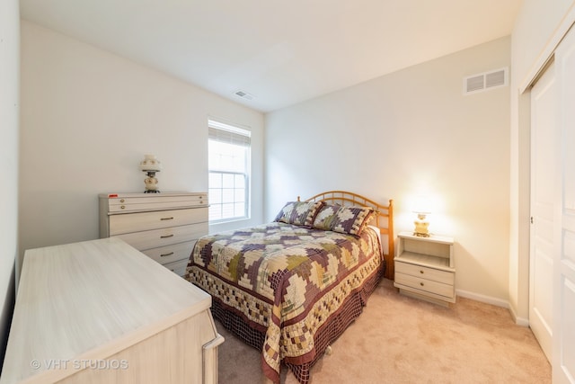 carpeted bedroom featuring a closet