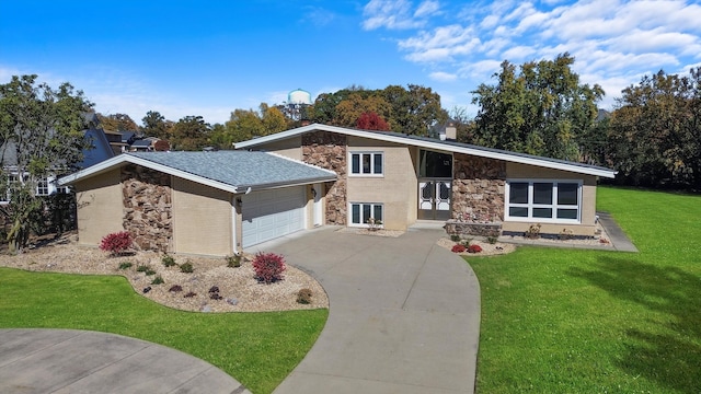 single story home featuring a garage and a front lawn