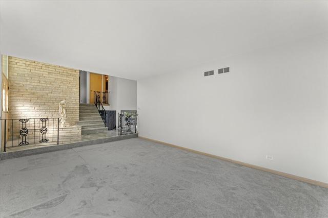 unfurnished living room featuring carpet