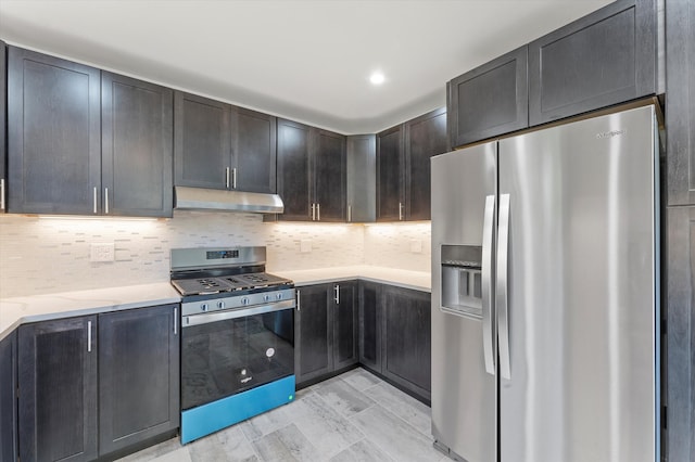 kitchen featuring light stone countertops, appliances with stainless steel finishes, light wood-type flooring, dark brown cabinets, and decorative backsplash