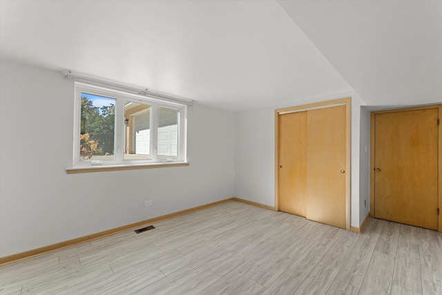 bonus room with light hardwood / wood-style floors