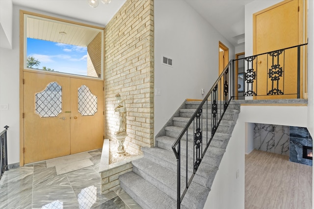 foyer entrance with light hardwood / wood-style flooring