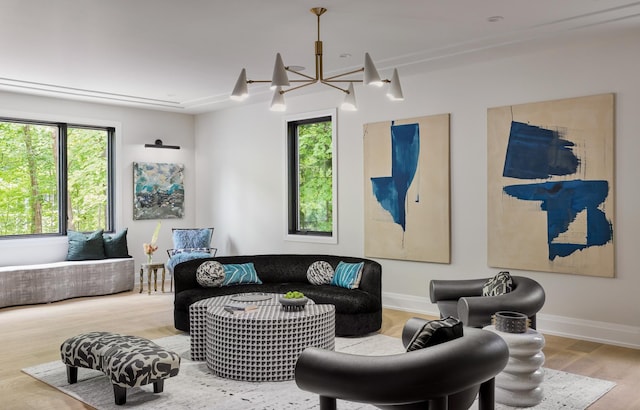 living room with light wood-type flooring and a notable chandelier