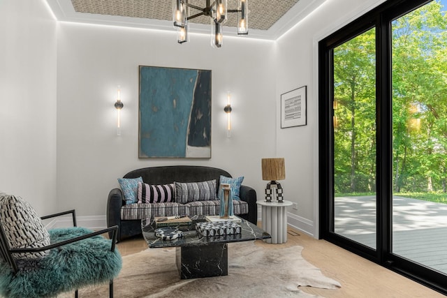 living area featuring a chandelier and wood-type flooring