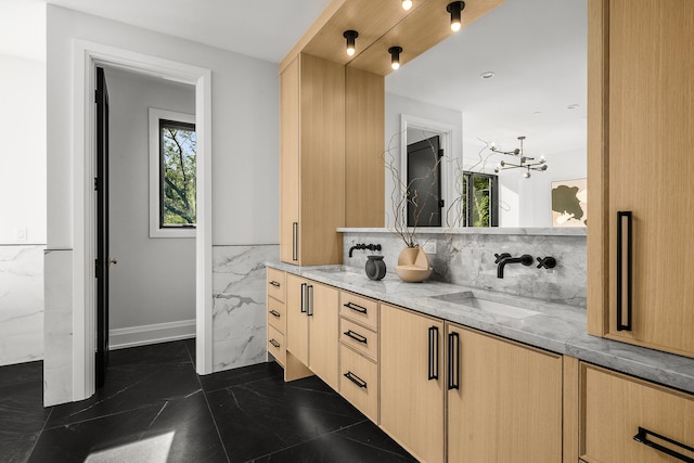 bathroom featuring vanity and an inviting chandelier