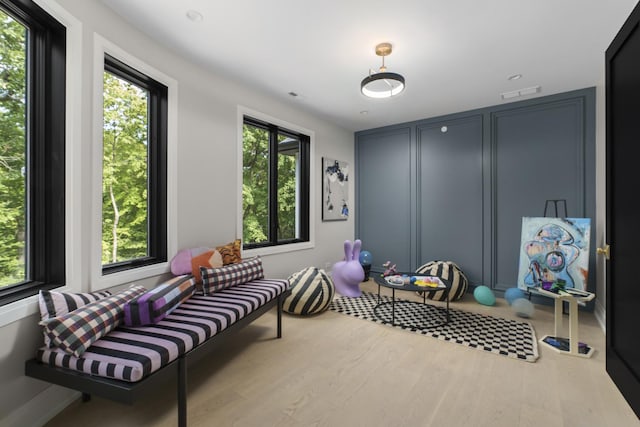 interior space featuring plenty of natural light and light hardwood / wood-style flooring