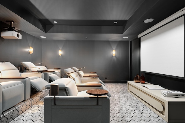 carpeted cinema featuring a tray ceiling