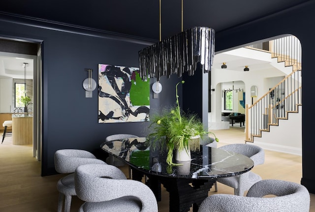 dining area with hardwood / wood-style flooring and plenty of natural light