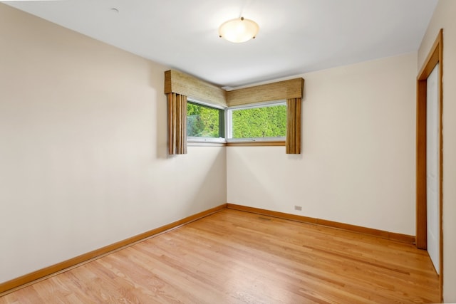 unfurnished bedroom with light wood-type flooring