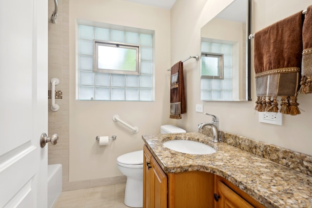 bathroom featuring tile patterned flooring, vanity, and toilet