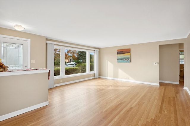 unfurnished living room featuring light wood-type flooring