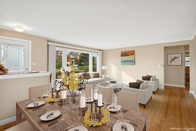 dining area featuring light wood-type flooring