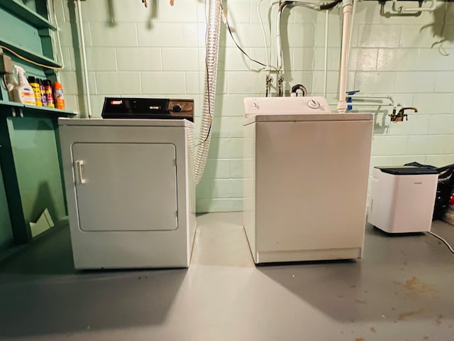 washroom with separate washer and dryer