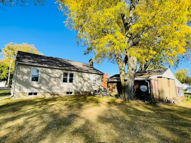 view of property exterior with a yard