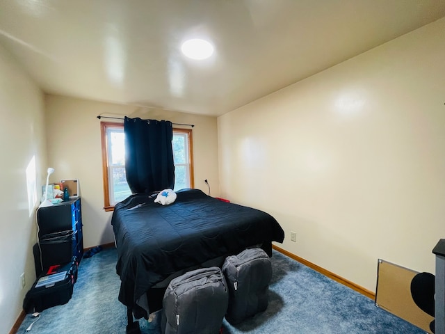 bedroom featuring dark carpet