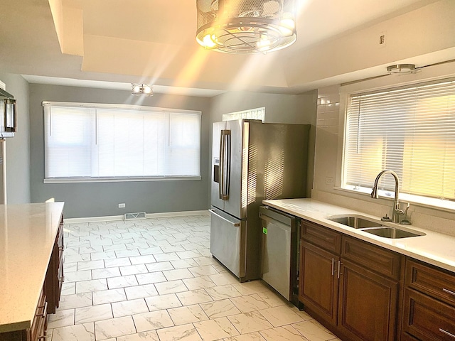 kitchen with appliances with stainless steel finishes and sink