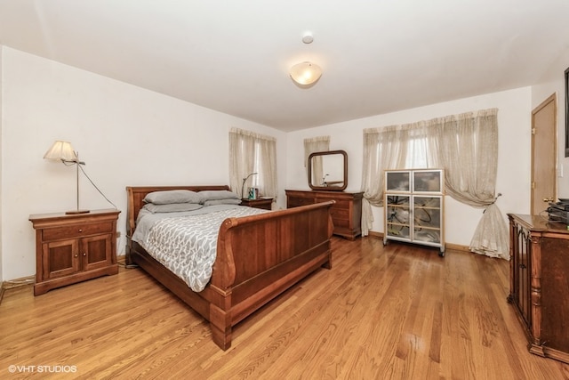 bedroom with light wood-type flooring