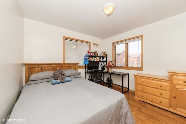 bedroom with light wood-type flooring