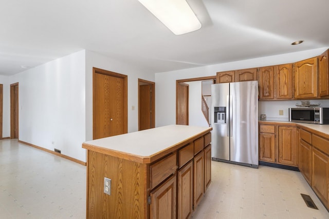 kitchen featuring stainless steel appliances and a center island