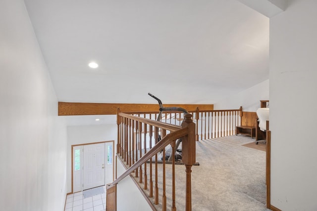 staircase with carpet and vaulted ceiling