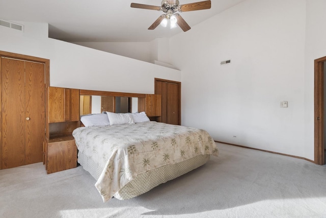 carpeted bedroom featuring ceiling fan and high vaulted ceiling