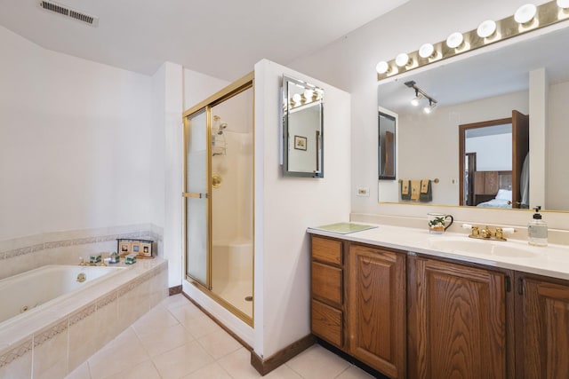 bathroom with vanity, separate shower and tub, and tile patterned flooring