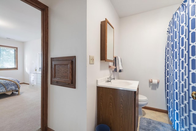 bathroom featuring vanity and toilet