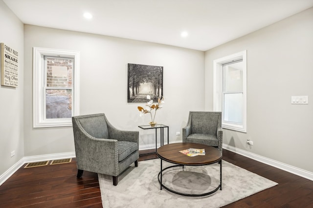 living area with hardwood / wood-style flooring