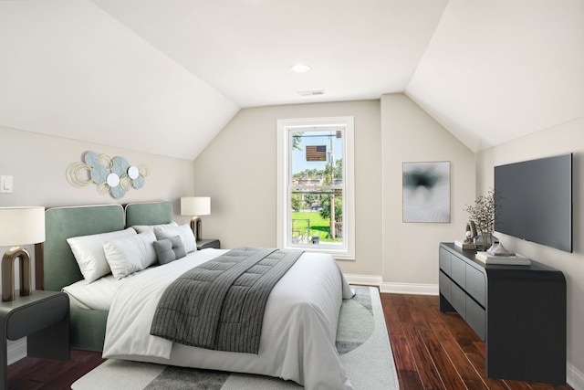 bedroom featuring vaulted ceiling and dark hardwood / wood-style flooring