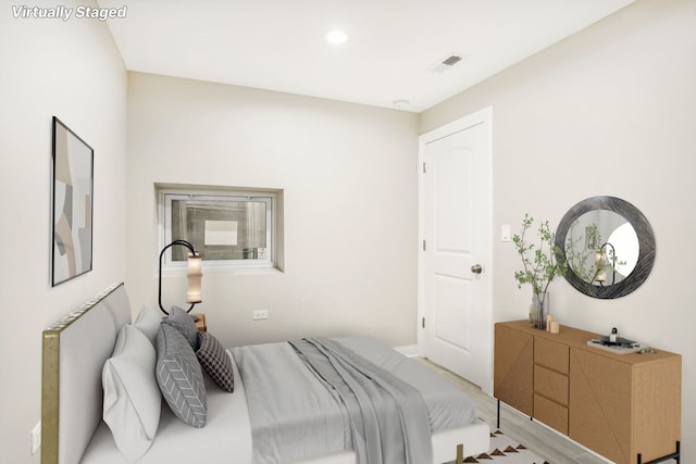 bedroom with light hardwood / wood-style flooring