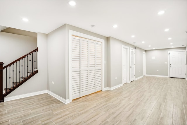 basement featuring light wood-type flooring