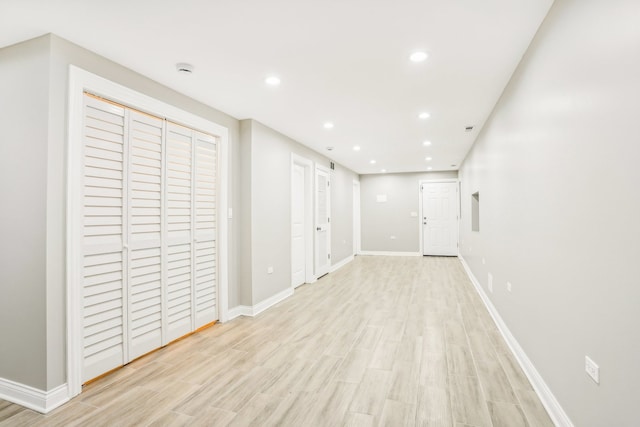 basement featuring light wood-type flooring