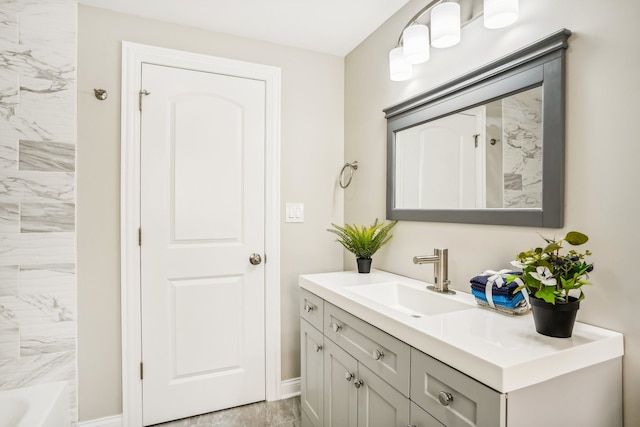 bathroom featuring vanity and a tub