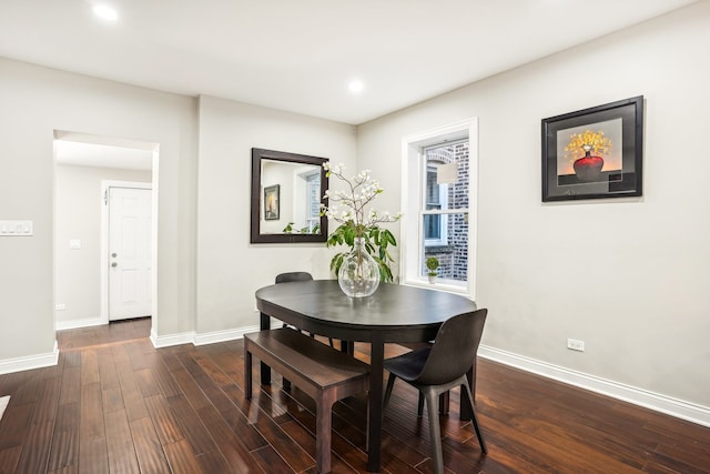 dining space featuring dark hardwood / wood-style floors