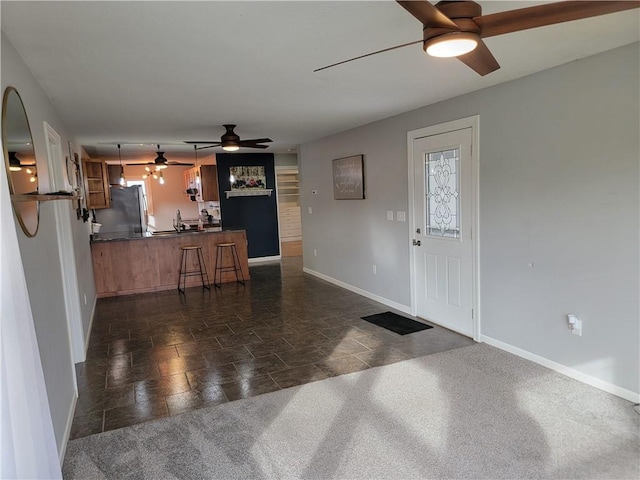 entryway featuring ceiling fan