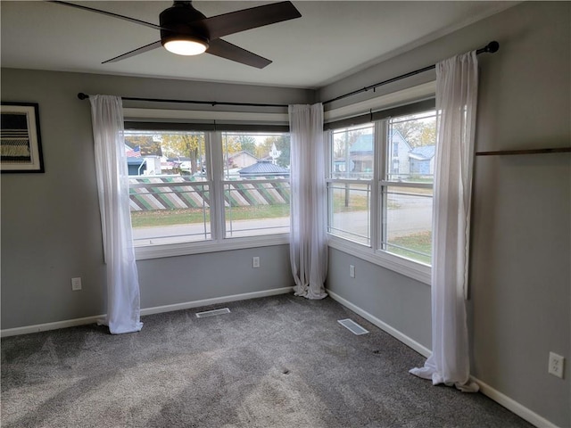 carpeted empty room with ceiling fan