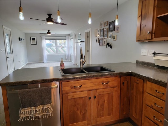 kitchen with kitchen peninsula, hanging light fixtures, sink, stainless steel dishwasher, and ceiling fan