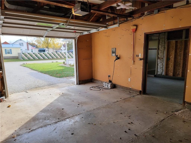 garage featuring a yard and a garage door opener